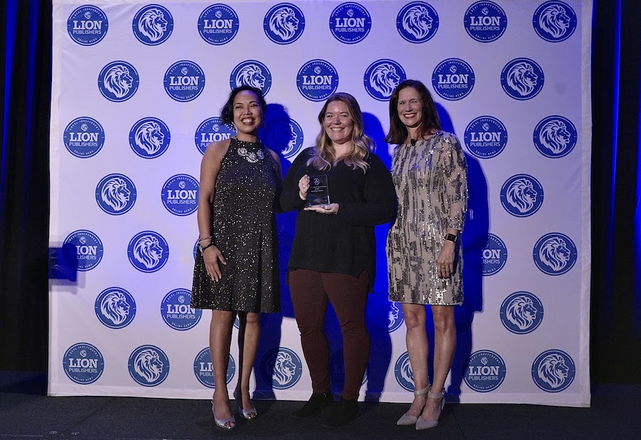 From left to right: Awards show co-host and LION revenue and operations director Phayvanh Luekhamhan; Richland Source’s Brittany Schock; awards show co-host and LION board chair Kelly Gilfillan. (Credit: LION Publishers)