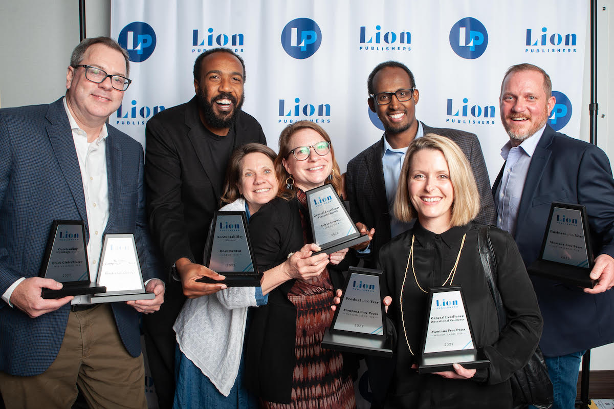2022 LION Journalism Awards winners holding trophies
